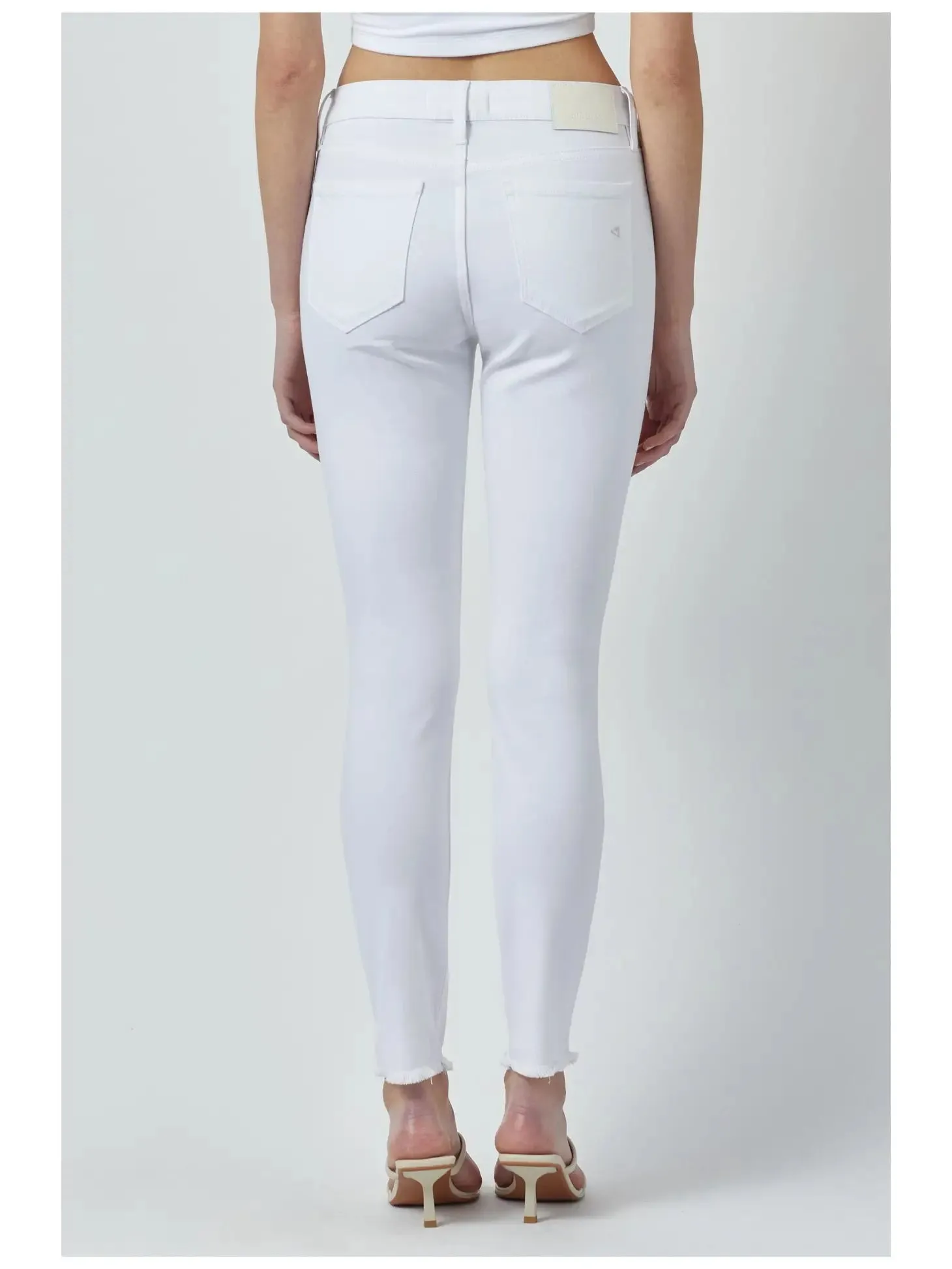 Hidden mid rise skinny frayed hem
