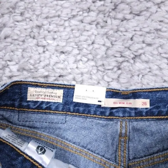 Levi’s Premium 80's Mom Jeans High Rise Tapered Distressed Size 26 x 30 Revolve