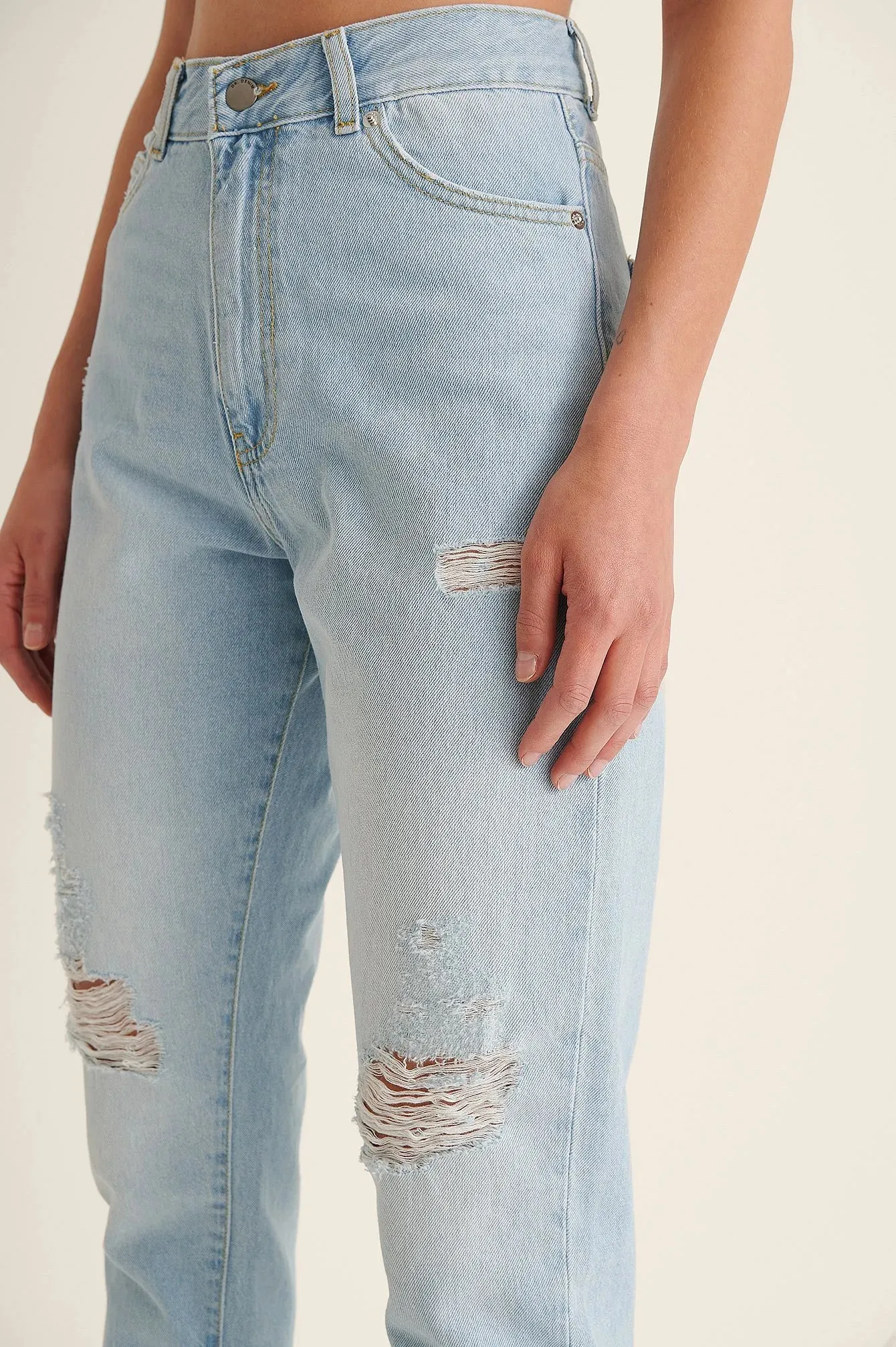 Light Blue Ripped Mom Jeans - Trendy & Edgy