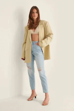Light Blue Ripped Mom Jeans - Trendy & Edgy