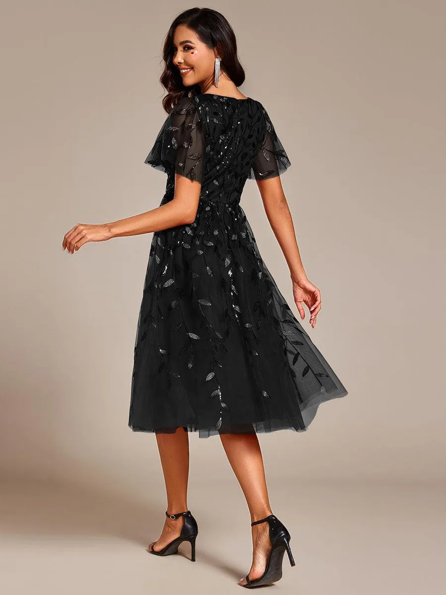 Robe d'invité de mariage formelle mi-longue à paillettes et feuilles à manches courtes