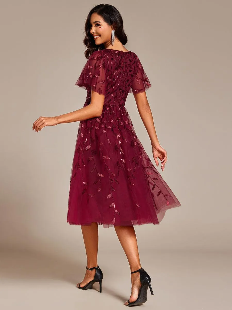 Robe d'invité de mariage formelle mi-longue à paillettes et feuilles à manches courtes