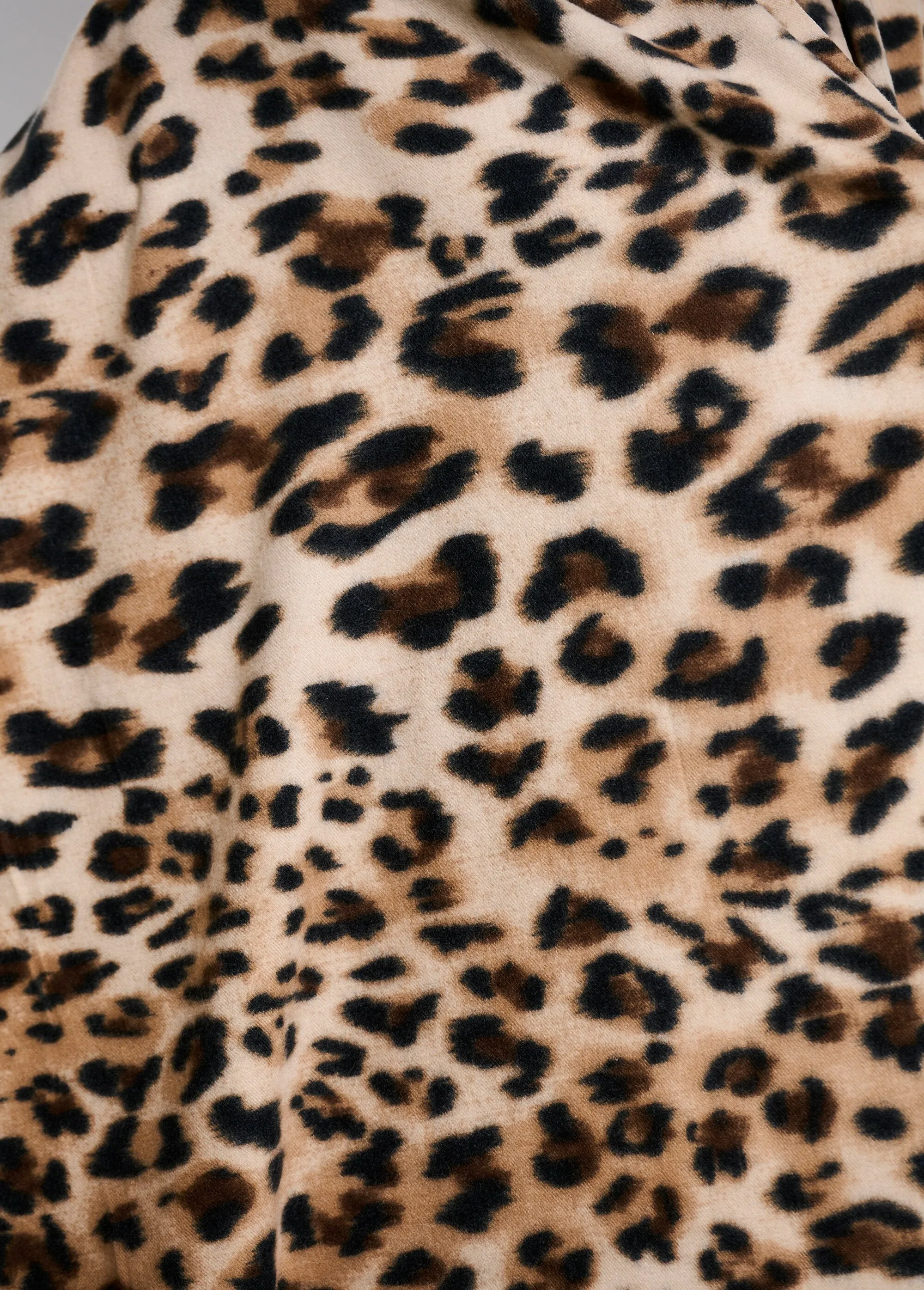 Warm wool scarf with leopard pattern
